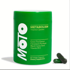Green supplement container labeled 'MOTO Metabolism' with capsules on a white background