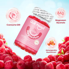 Pink supplement jar labeled 'Quit Mood Magnesium' surrounded by raspberries on a light blue background